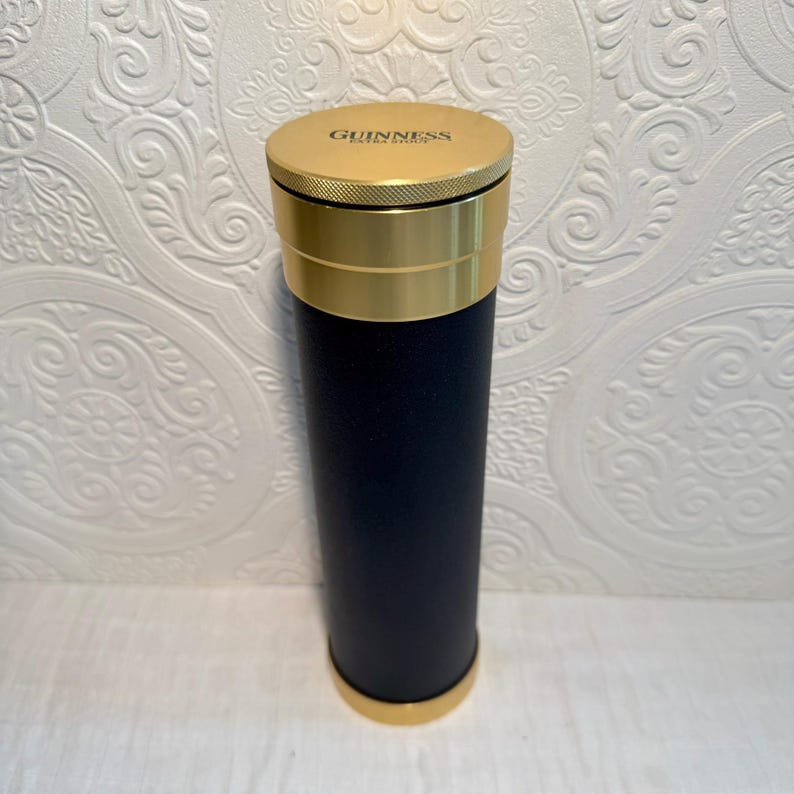 May include: A set of three ceramic mugs with a speckled, matte finish. The mugs are in shades of cream, light gray, and dark gray. Each mug has a simple, minimalist design and a rounded handle.