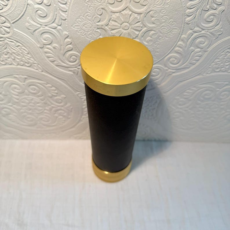 May include: A set of three ceramic mugs with a speckled, matte finish. The mugs are in shades of cream, light gray, and dark gray. Each mug has a simple, minimalist design, perfect for coffee or tea.
