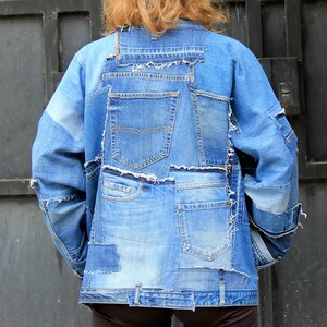 May include: A blue denim jacket made from repurposed denim with multiple pockets and frayed edges.