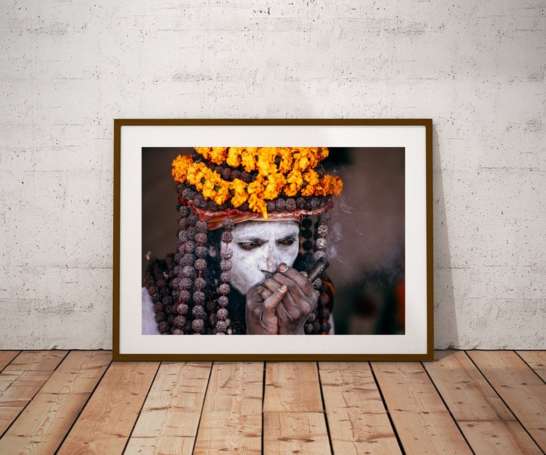 Portrait of Naga Baba, an Indian Holy Man Sadhu at Kumbh Mela: Wearing Colorful Orange Flowers , Beads and Smoking Chilum India Print image 2