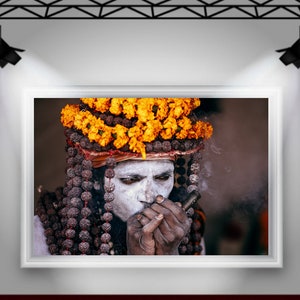 Portrait of Naga Baba, an Indian Holy Man Sadhu at Kumbh Mela: Wearing Colorful Orange Flowers , Beads and Smoking Chilum India Print image 8
