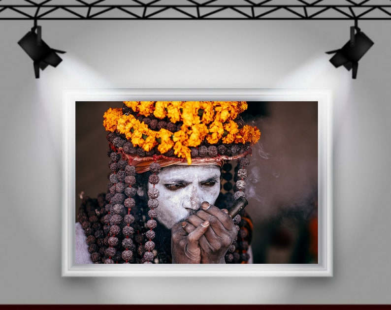 Portrait of Naga Baba, an Indian Holy Man Sadhu at Kumbh Mela: Wearing Colorful Orange Flowers , Beads and Smoking Chilum India Print image 8