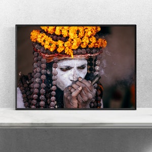 Portrait of Naga Baba, an Indian Holy Man Sadhu at Kumbh Mela: Wearing Colorful Orange Flowers , Beads and Smoking Chilum India Print image 4