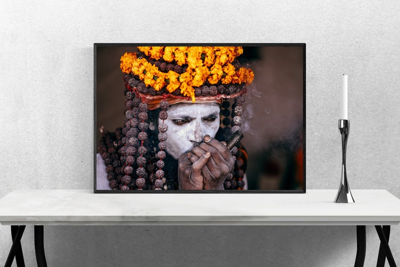 Portrait of Naga Baba, an Indian Holy Man Sadhu at Kumbh Mela: Wearing Colorful Orange Flowers , Beads and Smoking Chilum India Print image 4