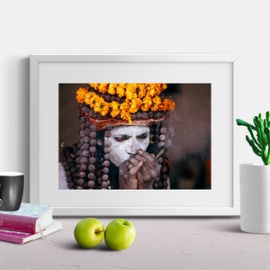 Portrait of Naga Baba, an Indian Holy Man Sadhu at Kumbh Mela: Wearing Colorful Orange Flowers , Beads and Smoking Chilum India Print image 6