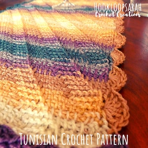 May include: A close-up of a colorful crocheted table runner with a scalloped edge. The runner is made with a variety of shades of brown, purple, teal, and cream yarn. The text "TUNISIAN CROCHET PATTERN" is visible at the bottom of the image.