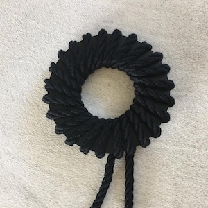 Extravagant black rope bracelet XL with black 6 in diameter wood ring and silver metal cord end caps