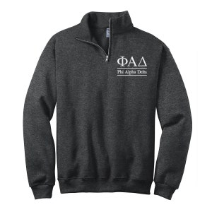 May include: A dark gray sweatshirt with a white embroidered Phi Alpha Delta logo and the words "Phi Alpha Delta" underneath.