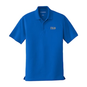 May include: A royal blue short-sleeved polo shirt with a gold embroidered Greek letter fraternity logo that says "ΠΚΦ".