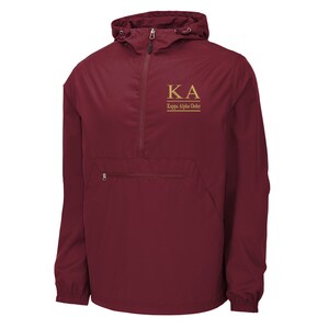 May include: A maroon windbreaker jacket with a gold zipper and a gold embroidered Kappa Alpha Order logo on the front.