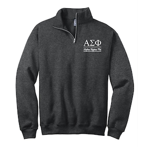 May include: A dark gray 1/4 zip sweatshirt with the letters "AΣΦ" and the words "Alpha Sigma Phi" in white.
