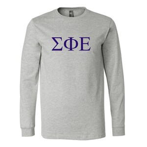 May include: A heather grey long-sleeve t-shirt with a purple Greek letter fraternity logo that says "ΣΦΕ".