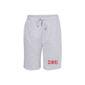 May include: Gray sweatpants with a red ΣΦΕ Greek letter logo.