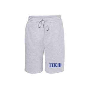 May include: Gray sweatpants with a blue embroidered Greek letter fraternity logo that says "ΠΚΦ".