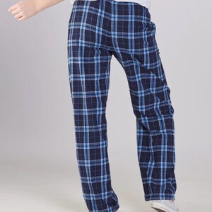 May include: Blue and white plaid pajama pants. The pants have a relaxed fit and a straight leg.