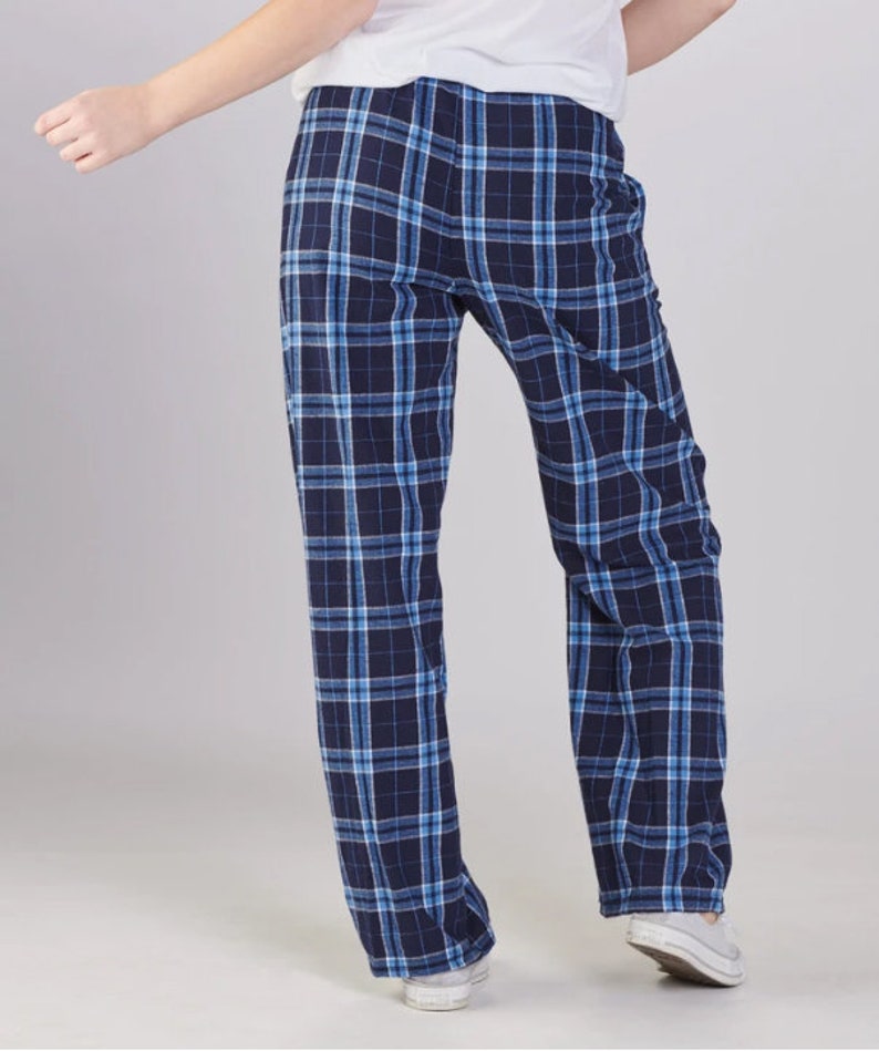 May include: Blue and white plaid pajama pants. The pants have a relaxed fit and a straight leg.