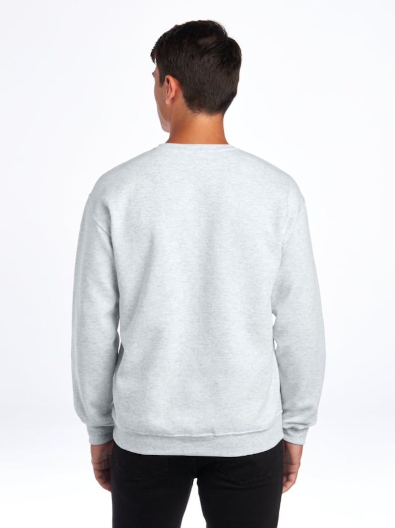May include: A heather gray sweatshirt with long sleeves and a crew neck.