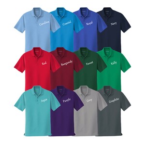 May include: Twelve polo shirts in various colors, including red, blue, green, purple, and gray. Each shirt has a different color name printed on the front in white text.