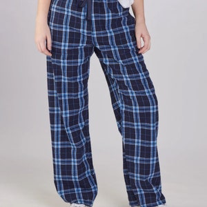 May include: Blue and white plaid pajama pants with a drawstring waist.