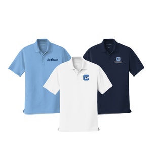 May include: Three polo shirts in different colors: light blue, white, and navy blue. Each shirt features a logo with the text "The Citadel" and a stylized "C" with a star.