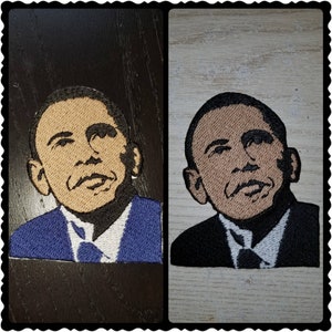 May include: Two embroidered patches of a person wearing a suit and tie. The patch on the left has a blue suit and a white shirt. The patch on the right has a black suit and a white shirt.