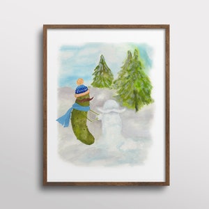 Whimsical Pickle in a Santa Hat Building a Snowman Watercolor Art Print image 1