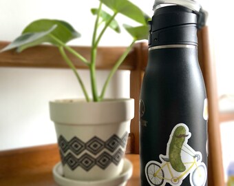 Whimsical Pickle Riding a Bicycle Laptop Water Bottle Stanley Cup Sticker