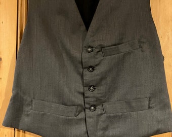 Small only - plain grey waistcoat with wool cloth back, lined in linen, 3 pockets, back belt to adjust fit