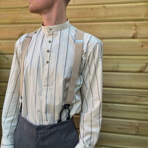 Gold cotton shirt with a dark stripe, collarless, in vintage style