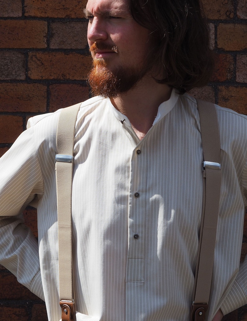 1920s Style Men’s Shirts | Peaky Blinders Shirts and Collars Collarless shirt in khaki and cream stripe cotton with cream neckband fastened with vintage collar stud $71.07 AT vintagedancer.com