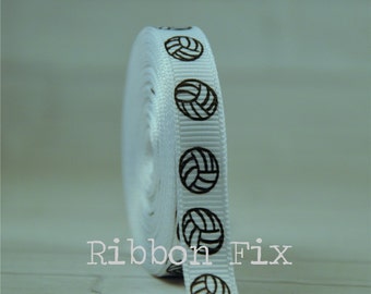 May include: White ribbon with black volleyball prints. The ribbon is rolled up and the text "Ribbon Fix" is visible in the lower part of the image.