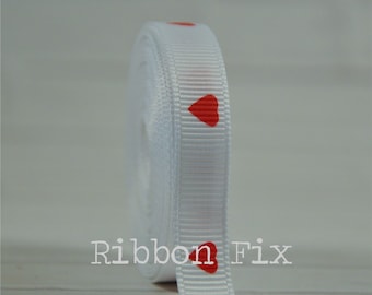 May include: White satin ribbon with red heart print.