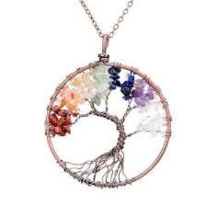 May include: A copper-colored pendant necklace featuring a wire-wrapped tree of life design. The tree's branches and roots are intricately crafted within a circular frame, adorned with colorful gemstones representing the chakras.