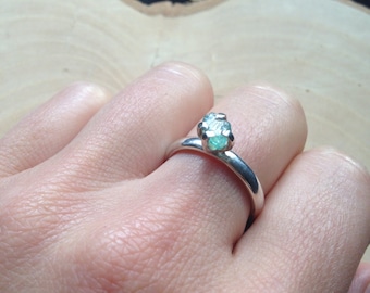 Neon blue apatite claw-set into a solid silver ring. Blue Solitaire Alternative Engagement Ring. UK size M.