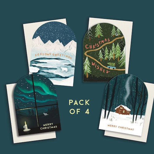 Paquete de 4 tarjetas navideñas arqueadas: cabaña escandinava, ventana, oso polar y árboles