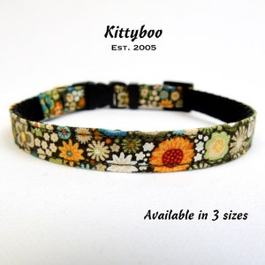 May include: A green, black and orange floral patterned dog collar with a black plastic buckle. Kittyboo Est. 2005. Available in 3 sizes.