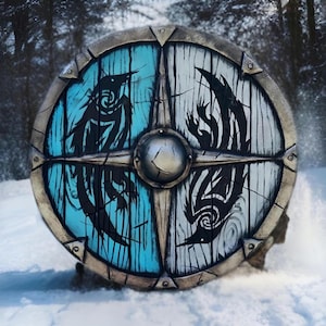 May include: A round wooden shield with a metal rim and a black and white design of two birds. The shield is painted in shades of blue and white and has a metal center boss.