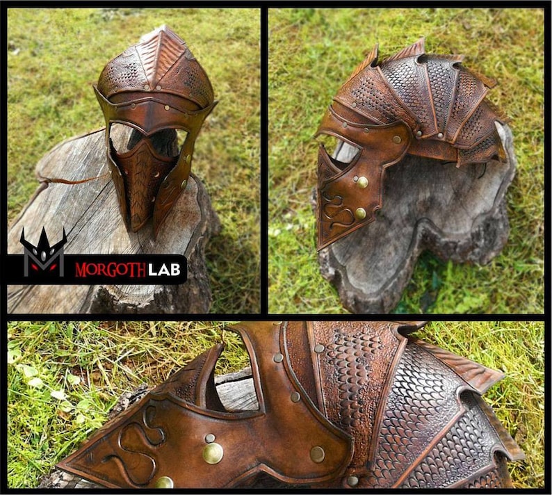 May include: A brown leather helmet with a dragon scale design. The helmet has a face mask with a pointed nose and eye holes. The helmet is decorated with brass rivets and studs. The helmet is sitting on a wooden stump.
