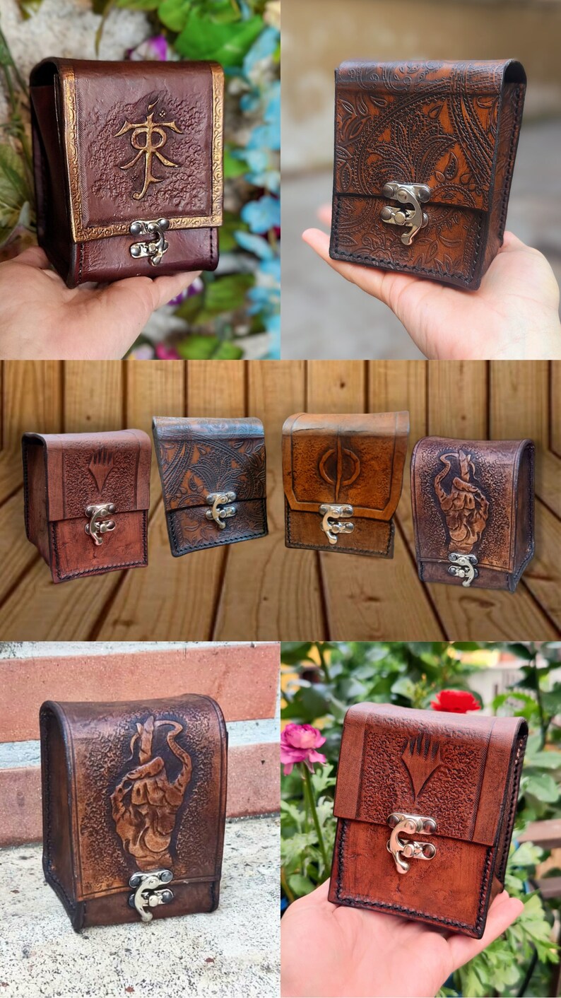 May include: A collection of six leather card cases with various designs. The cases are brown and have a flap with a metal clasp. The designs include a floral pattern, a symbol, a hand, and a symbol with a diamond shape.