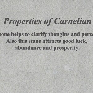 May include: Text on a gray background reads "Properties of Carnelian." The text below states the stone helps clarify thoughts and perception, and attracts good luck, abundance, and prosperity.
