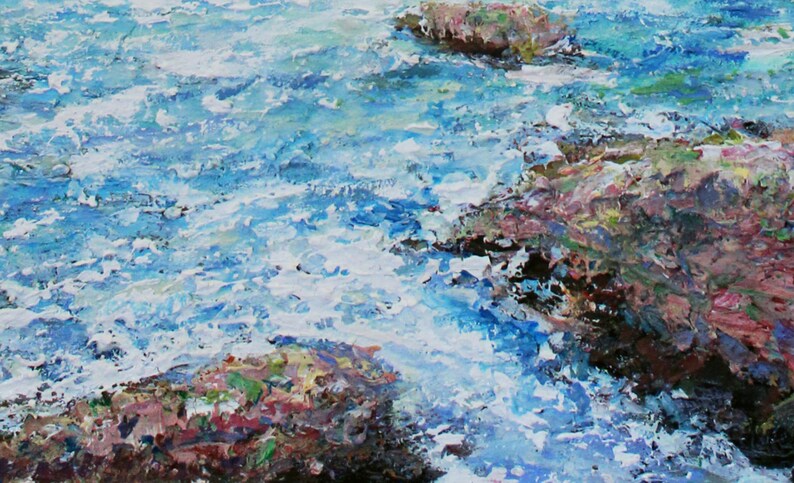 May include: A close-up of a painting depicting a rocky shoreline with blue water crashing against the rocks. The water is painted with thick, textured strokes, creating a sense of movement and energy. The rocks are painted in shades of brown, pink, and green, with hints of white and yellow.