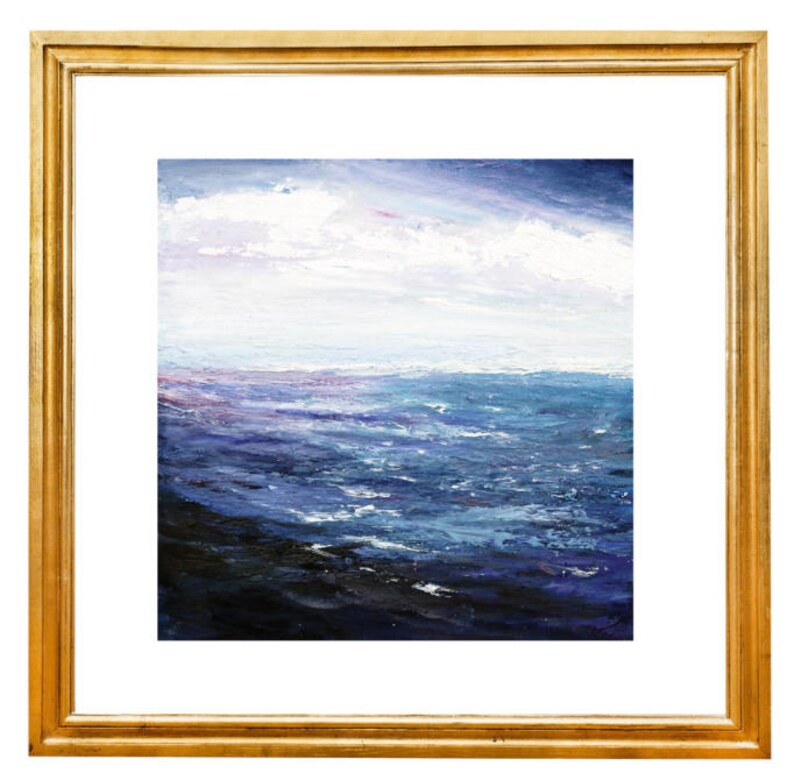 May include: A framed painting of a seascape with a blue and purple ocean and white clouds in the sky.