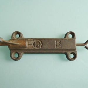A large pair of French golden curtain tie back hooks