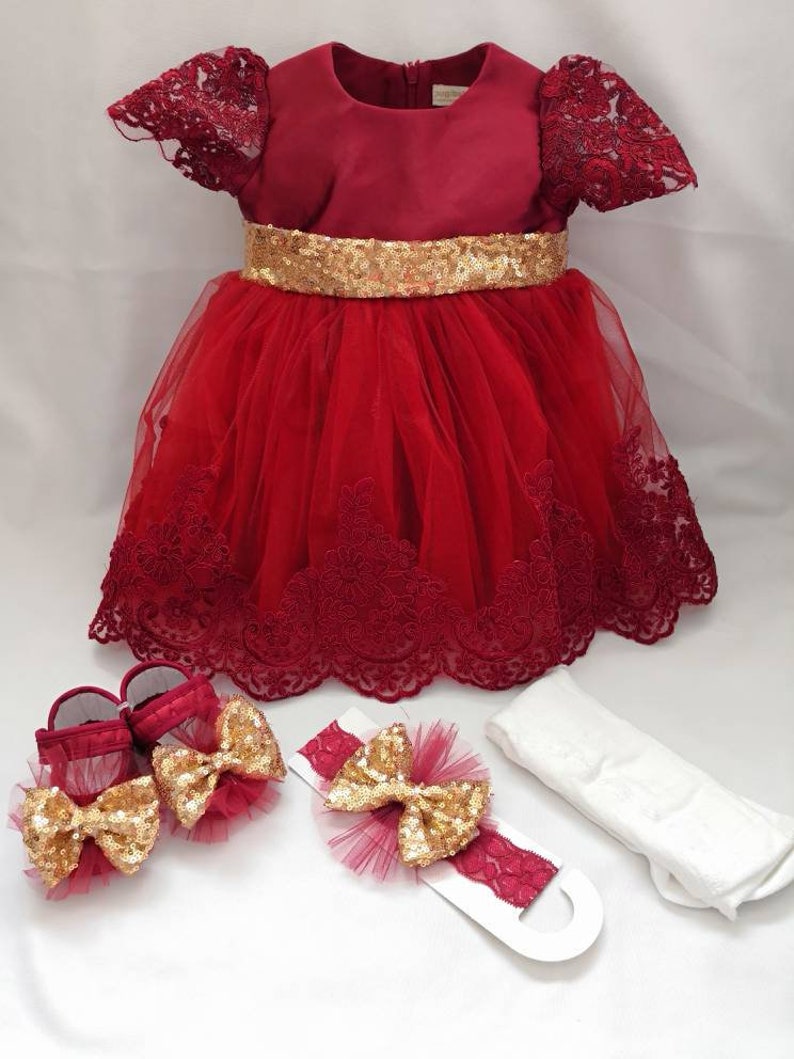 red newborn gown