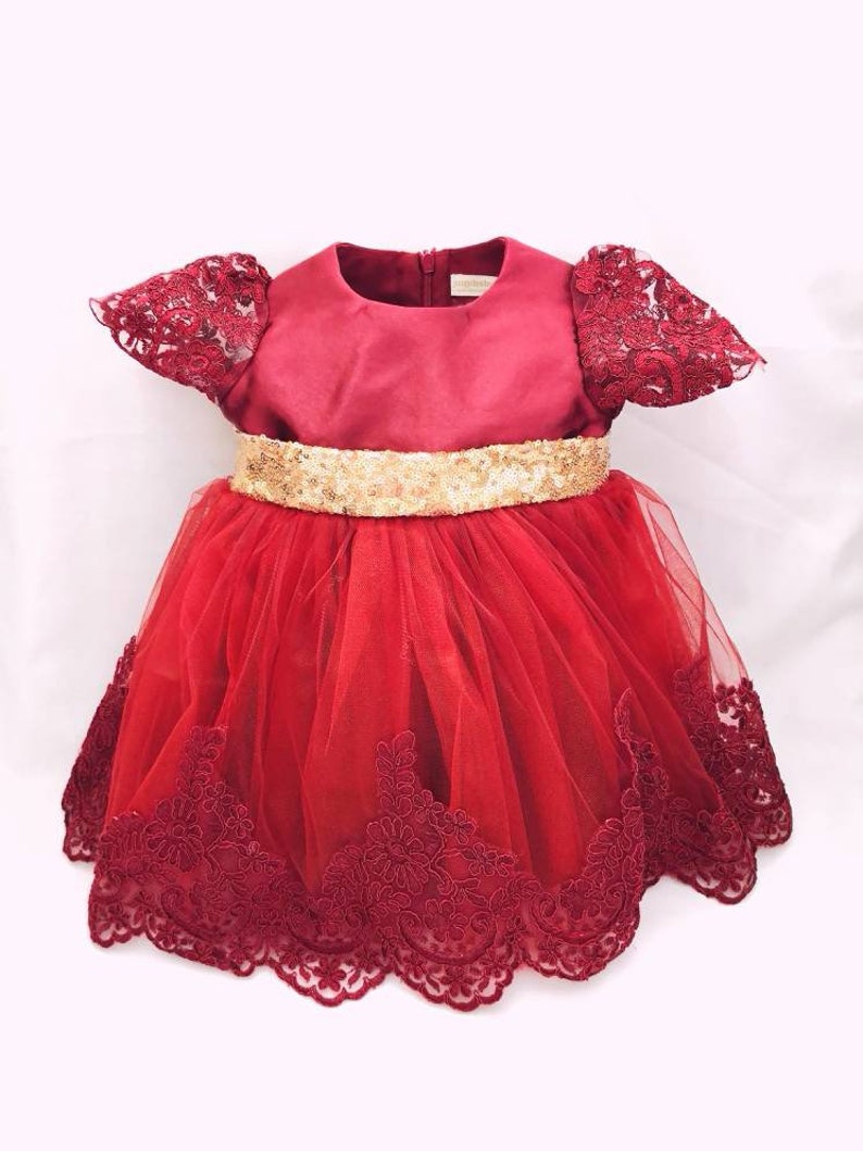 red newborn gown