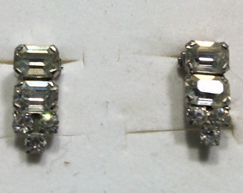Vintage fancy clip-on earrings in diamond-colored crystal rhinestones on silver-plated metal