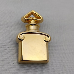 signed GUERLAIN vintage bottle brooch in gold metal