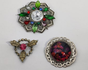 broches vintage de forme fleur en métal argenté et verre