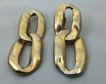 signed YVES SAINT LAURENT clip earrings in gold and silver metal