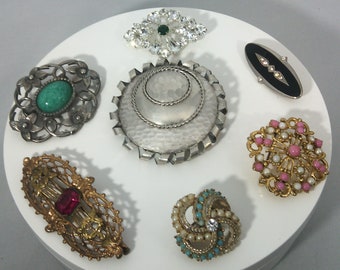 vintage and old brooches with historical interests